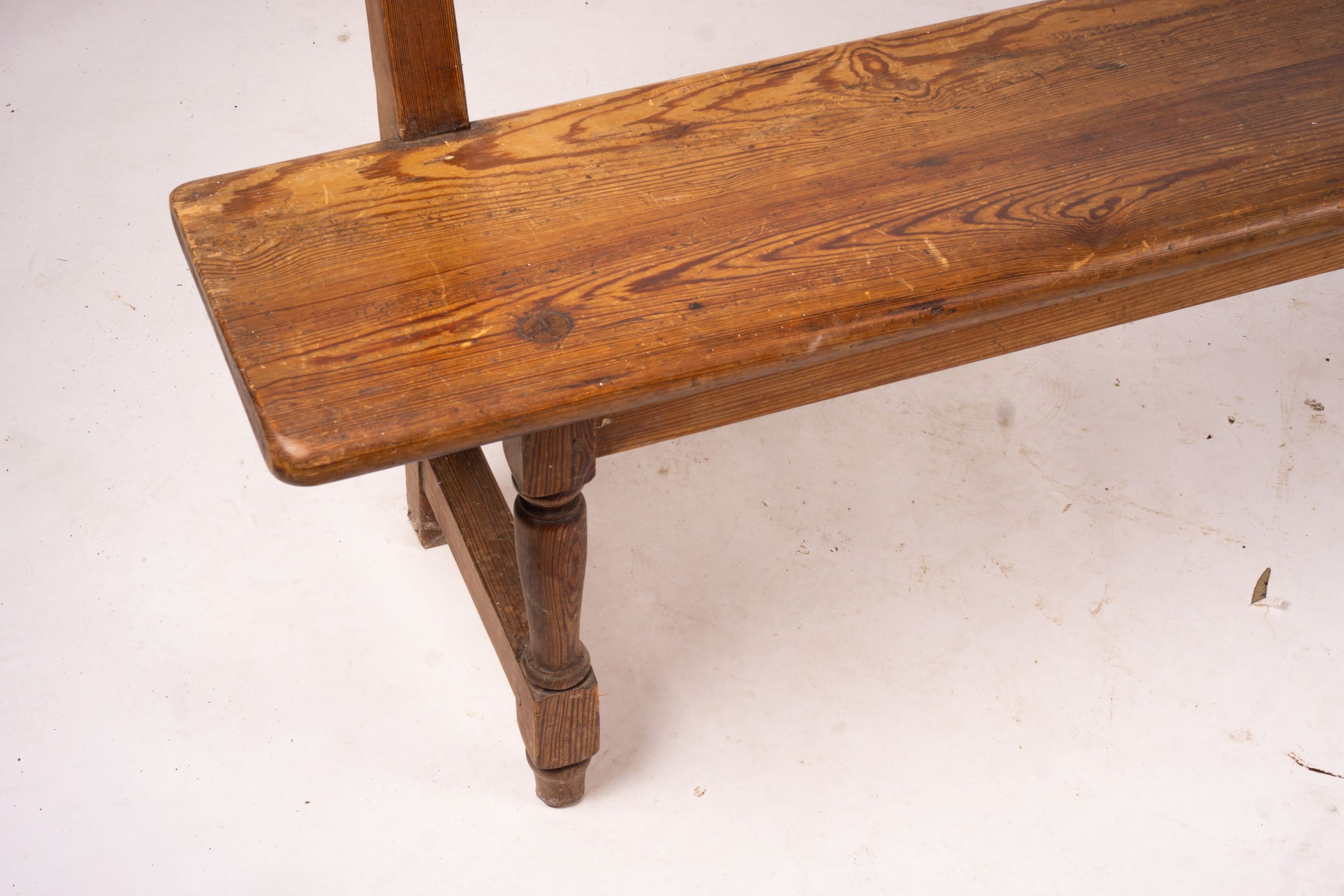 A Victorian pitch pine bench seat, W.214cm H.79cm